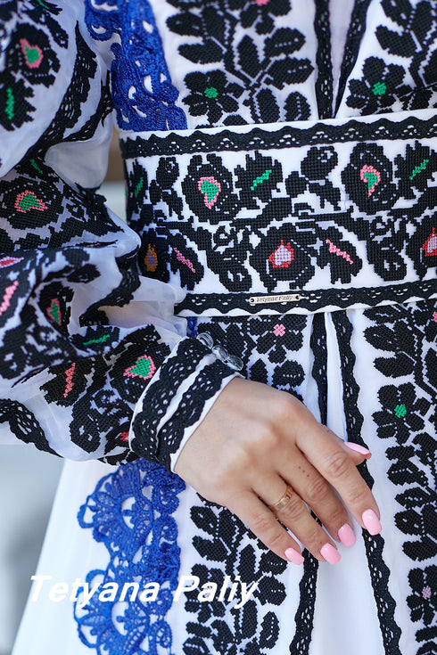 Kira's dress and Kai's men's embroidered shirt