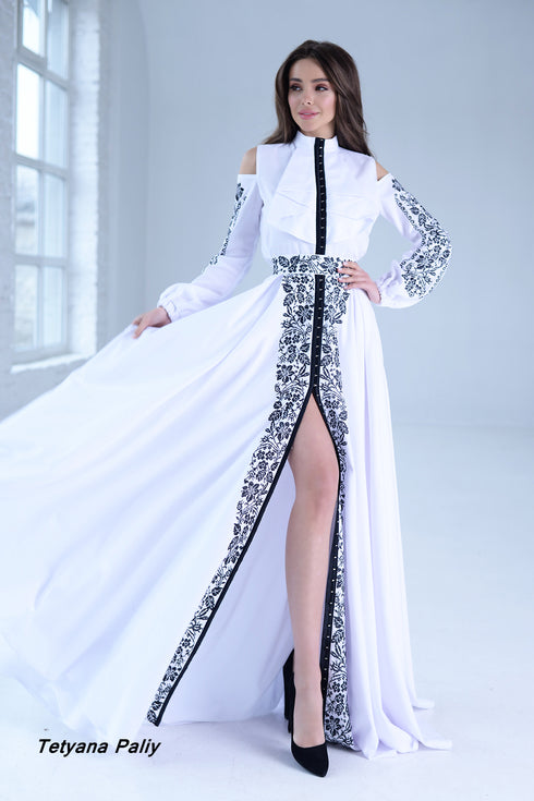 Dominika women's set (blouse, belt, skirt), Oscar men's shirt.